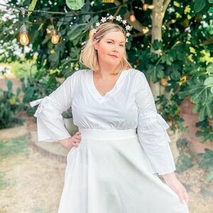 White top with bow sleeve detail